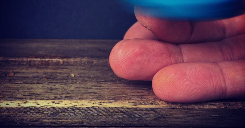 Trends - Person Playing Blue Hand Spinner