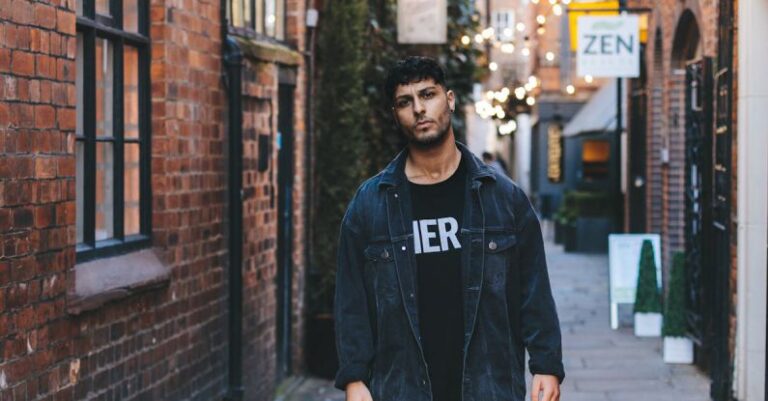 Styles - Man Wearing Jacket Standing Near Wall
