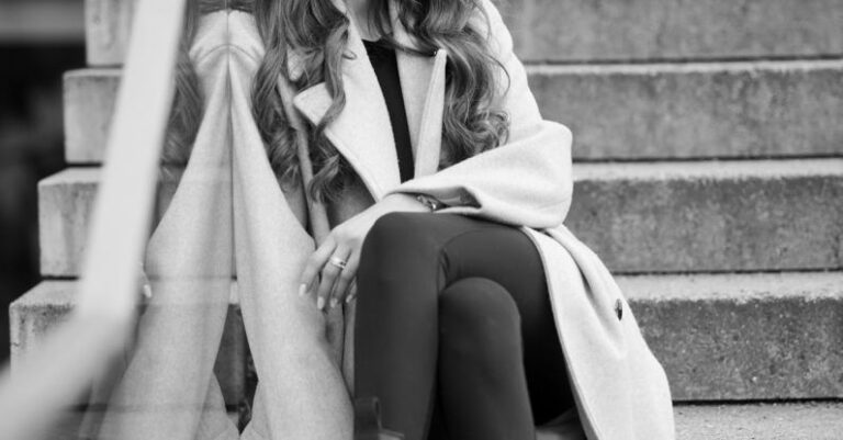 Styles - Fashionable Woman Sitting on Steps in City